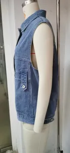 Detailed side profile of a women's loose casual denim vest in classic blue wash