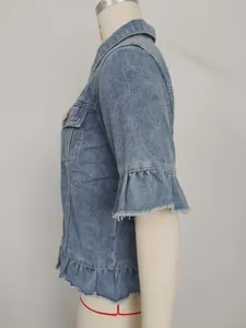 Side view of washed light blue denim jacket with ruffled sleeves and frayed edges