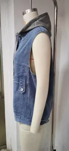 Side profile of a casual blue denim vest with a grey hood on a mannequin torso