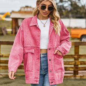 Front view of a vintage pink oversized denim jacket featuring large pockets and metal buttons