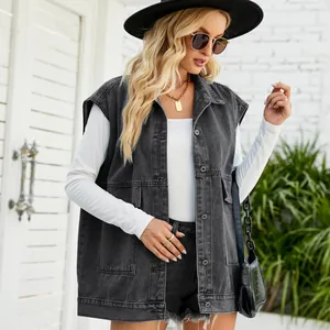 Detailed shot of woman wearing a stylish gray oversized denim vest with large pockets