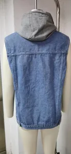 Back view detail of a casual women's sleeveless denim vest with grey jersey hood