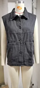 Front detail of women's loose dark grey denim vest with classic collar and button-down front