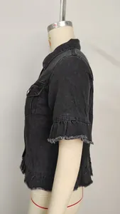 Side view of a washed black denim short-sleeved jacket with ruffled and frayed hems.