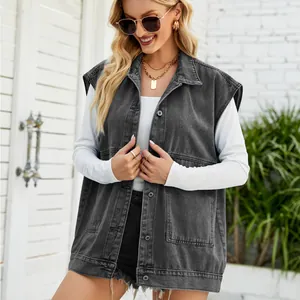 Detail view of a grey washed denim vest with oversized pockets.