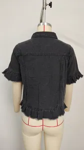 Back detail view of a black wash denim jacket featuring ruffled short sleeves and hem