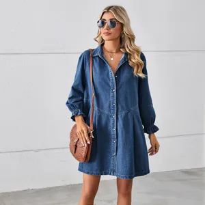 Washed long sleeve denim shirt dress with ruffled cuffs in a loose casual style.