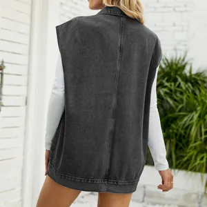 Close-up back view of a trendy black washed denim sleeveless vest on a female model