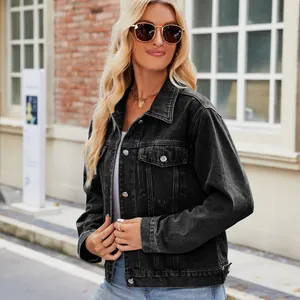 Detailed view of a fashionable women's slim-fit washed black denim jacket with silver buttons