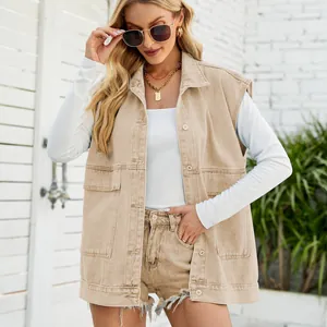 Stylish khaki denim vest and matching fringed shorts worn by blonde model outdoors