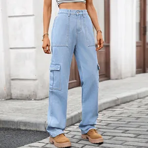 Detailed view of light blue washed denim cargo pants with large side utility pockets.