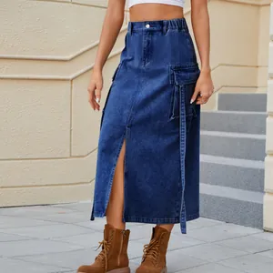 Detail view of washed blue denim cargo midi skirt with elastic waist and front slit