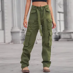 Detail of army green washed cargo pants featuring multiple flap pockets and matching belt