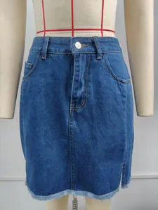 Detailed view of high-waisted denim mini skirt with side slit and frayed hem.