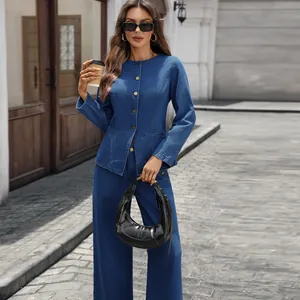 Woman wearing fashionable blue denim long sleeve jacket and wide leg pants suit