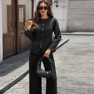 Chic black denim two-piece set styled with a coffee cup in an urban street setting.