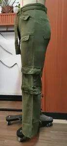 Detailed side view of olive green washed denim cargo pants featuring multi-flap pockets