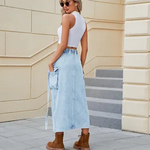 Back view detail of a stylish light wash cargo denim skirt featuring large side pockets.
