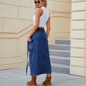 Detail view of washed denim cargo skirt with elastic waist and pockets