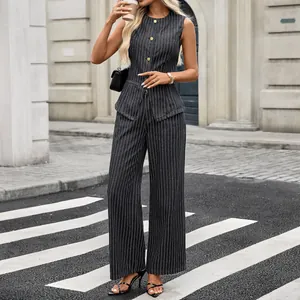 Outdoor lifestyle shot of a chic pinstripe denim sleeveless top and wide-leg pants set