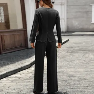 Back view of a stylish washed black denim set with a long-sleeve top and wide-leg pants