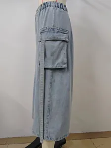 Detailed side view of light blue washed denim cargo skirt with elastic waist strap