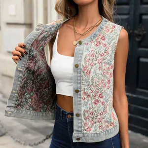 Close-up of vintage floral jacquard denim vest with button closure and distressed edges