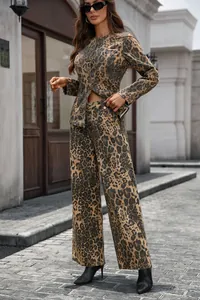 Detailed full-body street shot of women's leopard print washed denim suit with wide legs