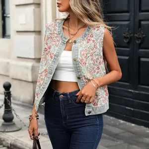 Model wearing a vintage floral jacquard sleeveless vest with denim trim and gold buttons