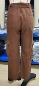 Back view of brown denim cargo pants featuring multiple utility pockets on mannequin