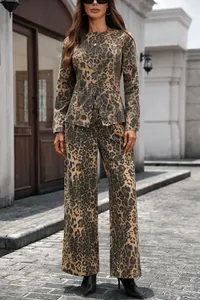 Model wearing leopard print denim jacket and wide-leg trousers set in a street setting