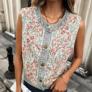 Detailed view of women's vintage floral jacquard vest with stylish denim patchwork trim