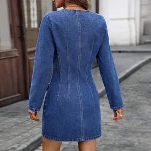Detailed back view of a stylish long-sleeve blue washed denim mini dress with fitted waist