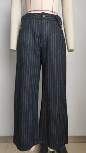 Detailed front view of women's high-waisted pinstripe denim trousers with side buttons