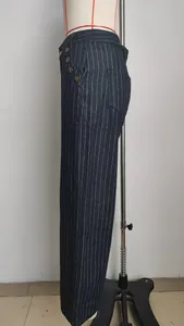 Side view of dark blue pinstripe denim trousers with retro button details on mannequin.