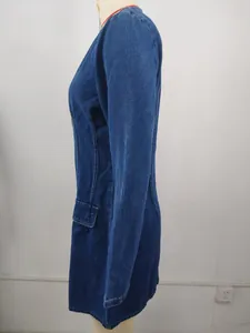 Side view of a stylish washed blue denim long sleeve dress with waist cinching