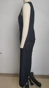 Side view of a navy pinstripe sleeveless denim vest and matching trousers on a mannequin.