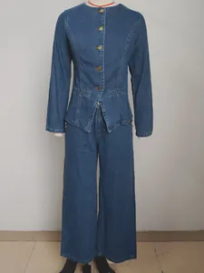 Washed blue denim set featuring long-sleeve jacket and wide-leg pants on mannequin