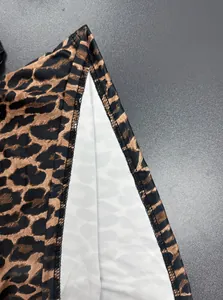 Close-up detail of high-quality leopard print fabric showing precision seam stitching