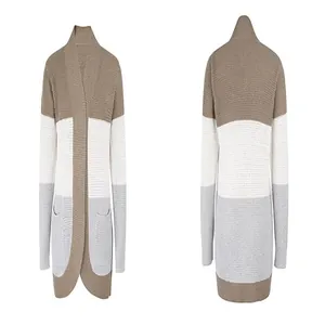 Dettaglio del cardigan in maglia color-block con orlo curvo e ampie tasche laterali