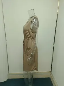 Side view of a beige sleeveless tank dress with drawstring waist and pockets