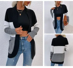 Viste dettagliate del cardigan in maglia a nido d'ape color-block con grandi tasche laterali.