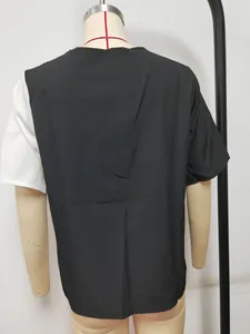 Detaillierte Rückansicht eines kurzärmeligen Damen-Cardigans im Color-Block-Design