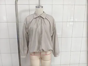 Detailed view of fashionable loose batwing sleeve lightweight solid color beige jacket