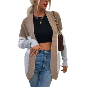 Elegante cardigan in maglia color-block con grandi tasche curve e design frontale aperto