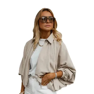 Fashionable loose batwing sleeve puff jacket in beige, lightweight autumn outerwear for women.