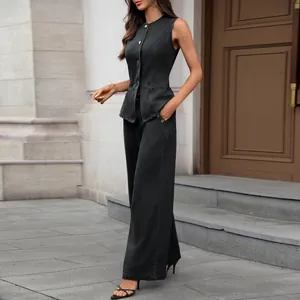 Full view of elegant dark grey washed denim sleeveless vest and wide-leg pants set
