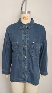 Detailed front view of a retro washed blue loose denim shirt displayed on a mannequin