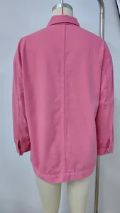 Detailed back view of a classic vintage pink loose fit denim jacket for women on mannequin