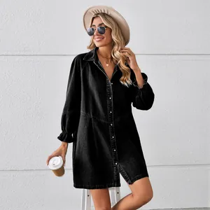 Washed black denim long-sleeved dress with ruffled cuffs and button front
